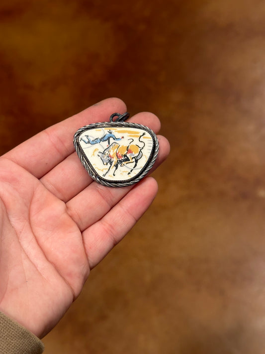 “Bucked off” pendant